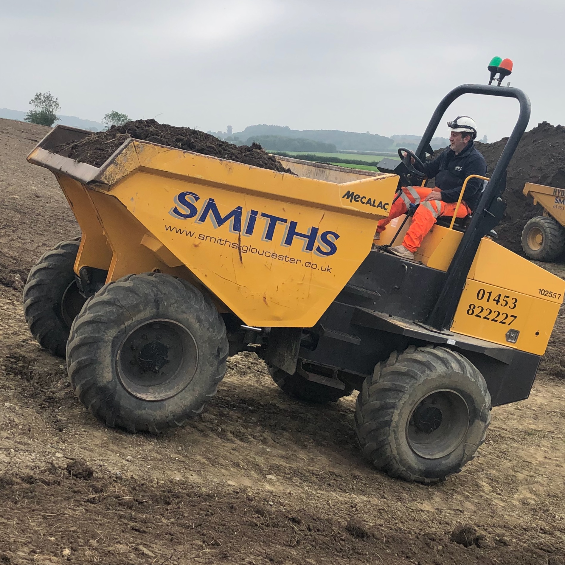 Forward Tipping Dumper Travelling up slopes with a full skip on NPORS Training Delivered by Tuppco.